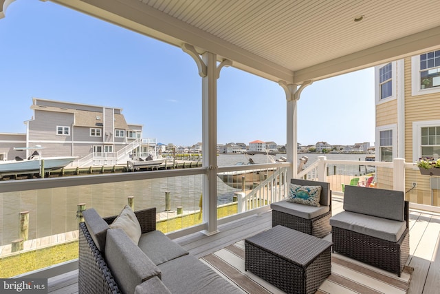 wooden deck with a water view