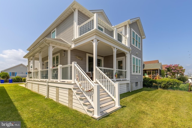 exterior space featuring a lawn and a porch