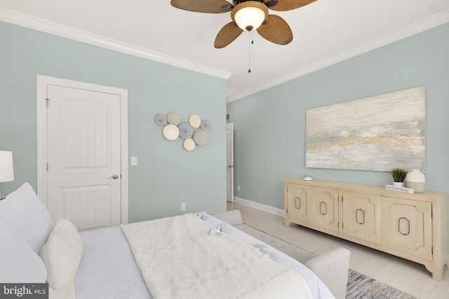 bedroom with ornamental molding and ceiling fan