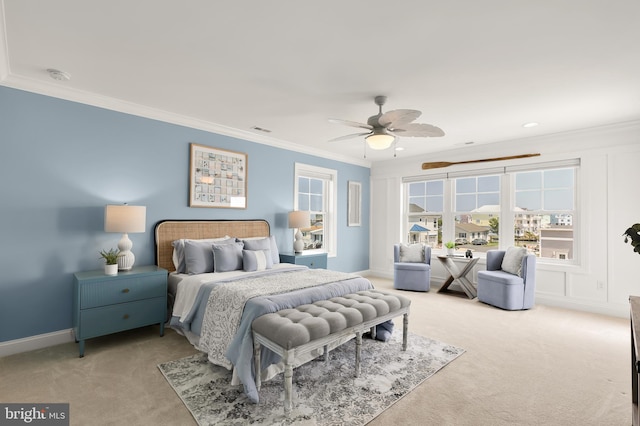 bedroom with ceiling fan, crown molding, and light colored carpet