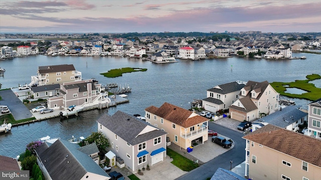 aerial view at dusk with a water view