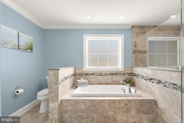 bathroom featuring tiled bath, toilet, and ornamental molding