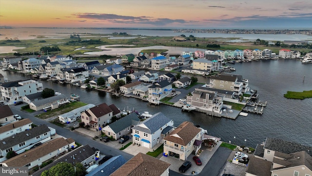 aerial view at dusk with a water view