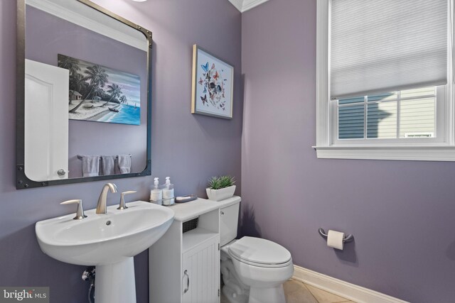 bathroom with tile patterned flooring, toilet, and sink