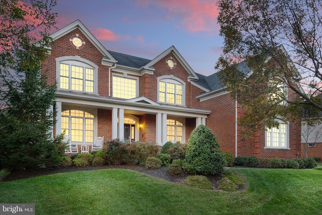 view of front of house with a yard