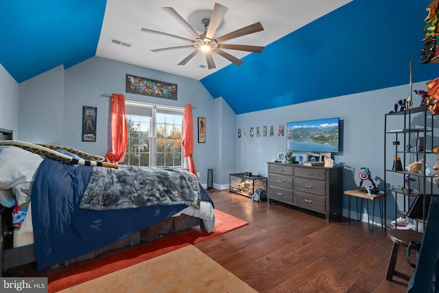 bedroom with lofted ceiling, ceiling fan, and dark wood-type flooring