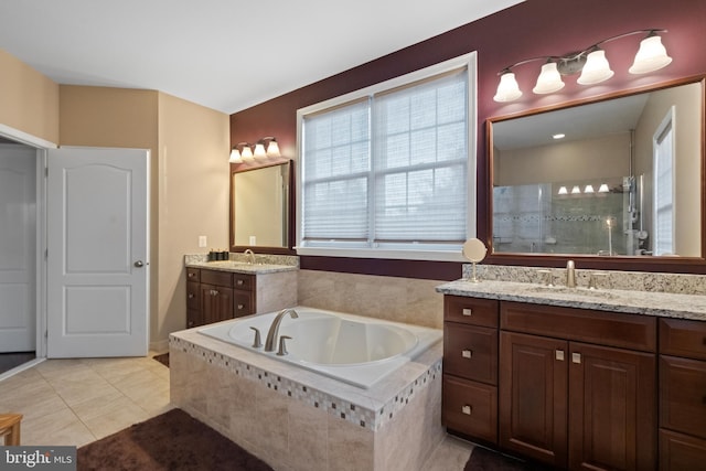 bathroom with vanity, tile patterned floors, and separate shower and tub