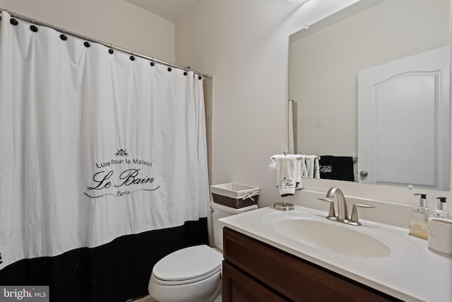 bathroom with vanity and toilet