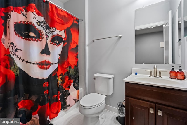 bathroom with tile patterned floors, vanity, and toilet