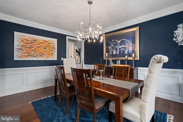 dining room featuring a chandelier, dark wood-type flooring, and crown molding