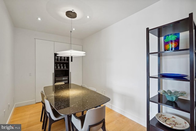 dining room with hardwood / wood-style floors