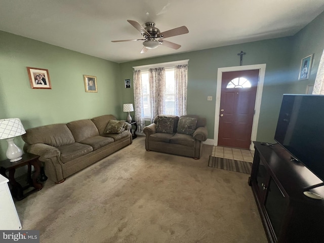 living room featuring light colored carpet and ceiling fan