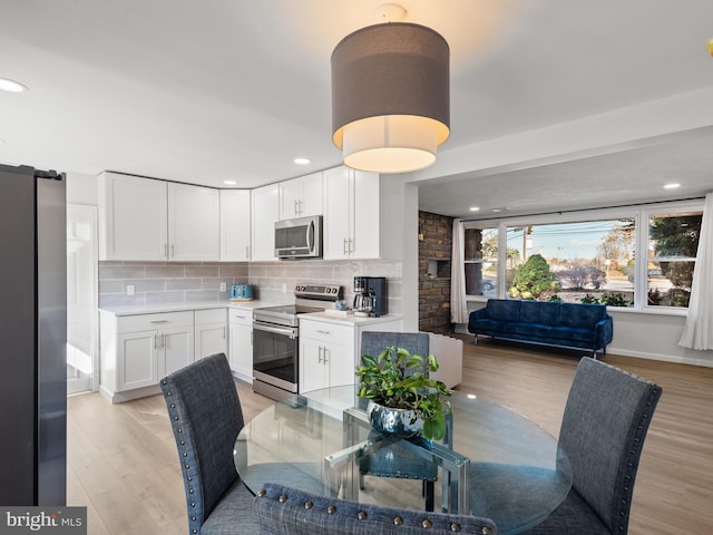 dining space featuring light hardwood / wood-style flooring