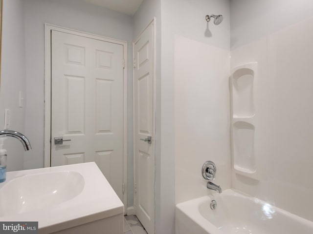 bathroom featuring vanity, tile patterned flooring, and bathtub / shower combination