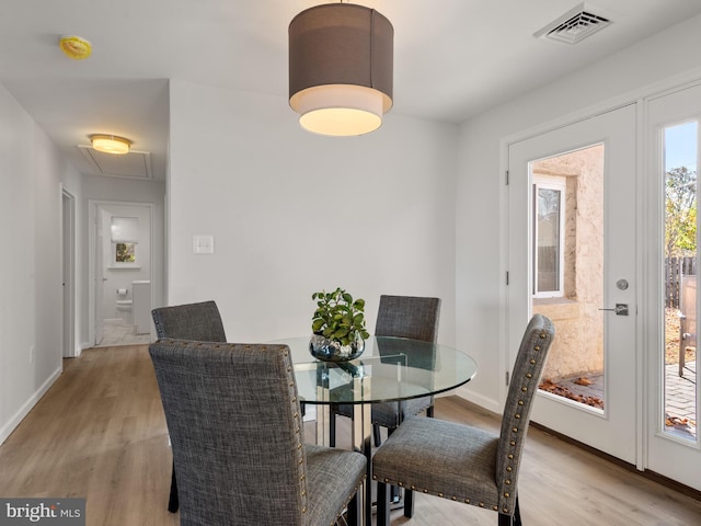 dining room featuring light hardwood / wood-style floors