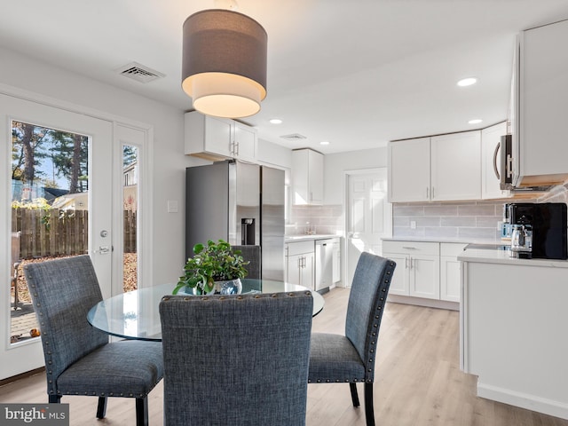 dining room featuring light wood-type flooring