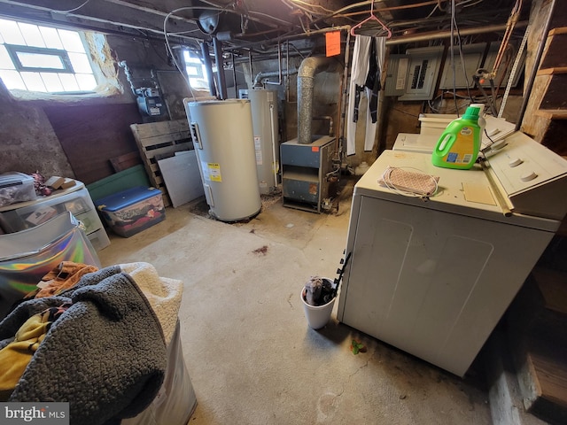 basement featuring separate washer and dryer, water heater, and gas water heater