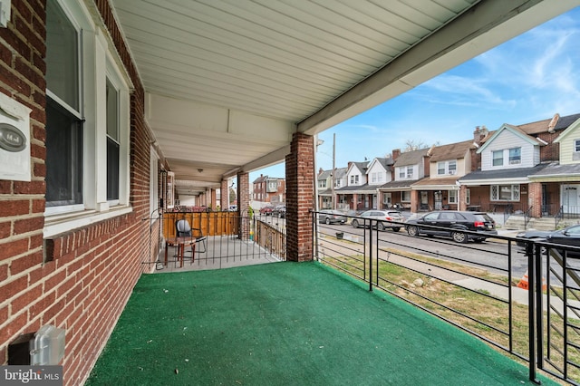 balcony featuring covered porch