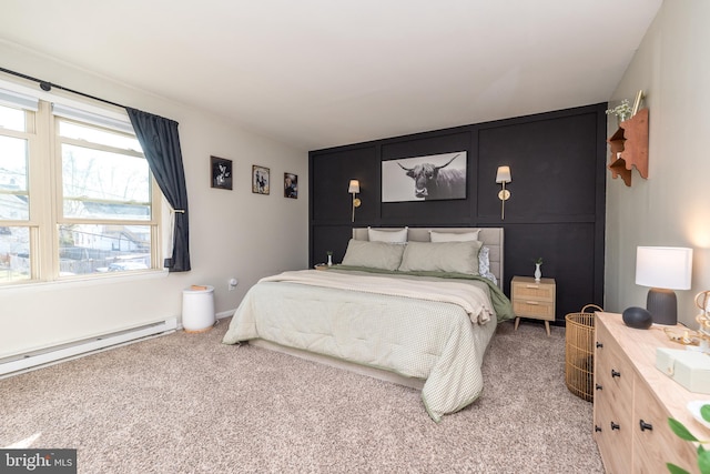 carpeted bedroom featuring a baseboard radiator