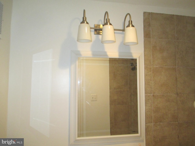 bathroom with tiled shower