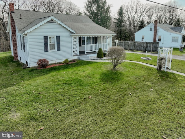 exterior space with a front yard and covered porch