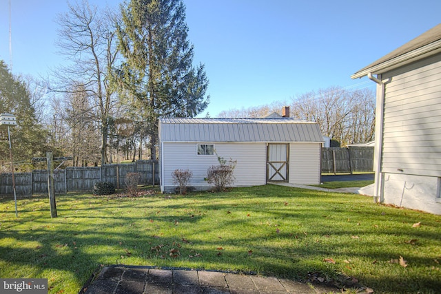 view of outdoor structure with a lawn