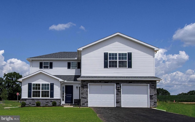 view of front of home with a shingled roof, aphalt driveway, a front yard, stone siding, and an attached garage