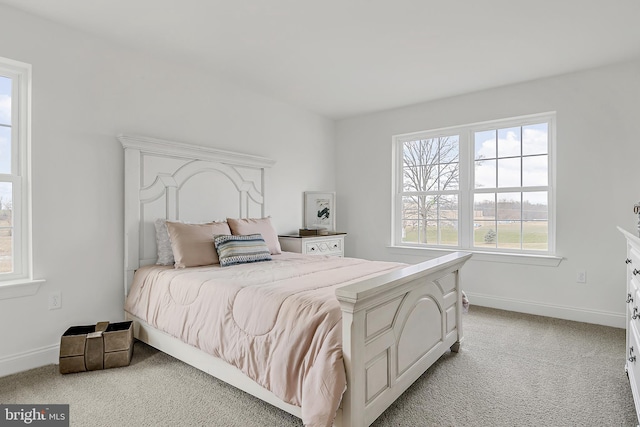 bedroom featuring light colored carpet