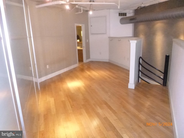 basement with light hardwood / wood-style floors