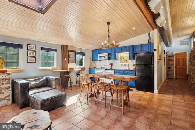 dining space featuring vaulted ceiling with skylight, wood ceiling, an inviting chandelier, and light tile patterned flooring