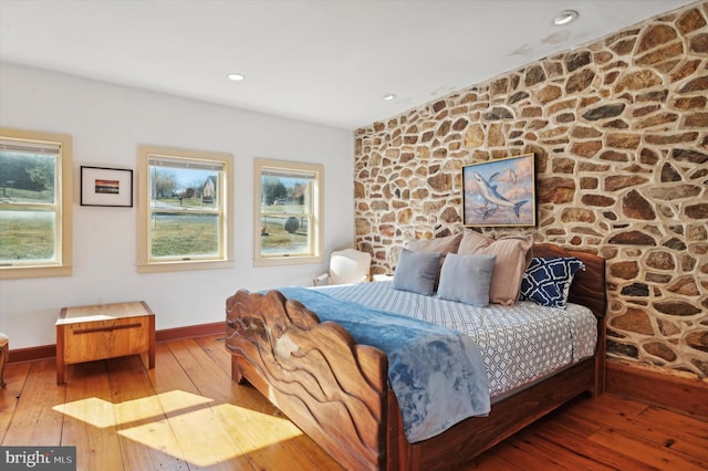 bedroom featuring wood-type flooring