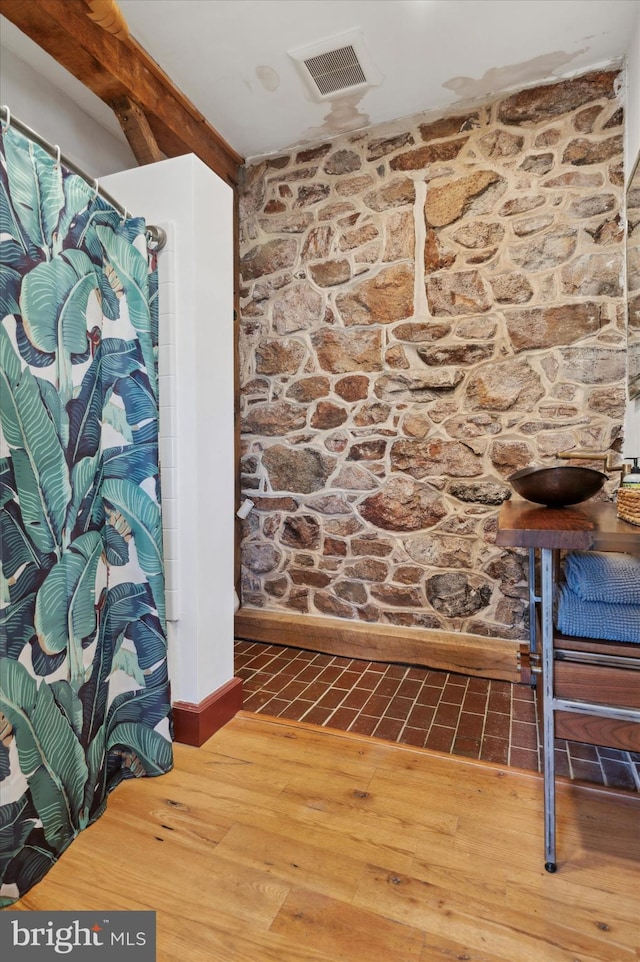 bathroom with wood-type flooring