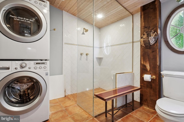 clothes washing area featuring wooden ceiling, tile patterned floors, and stacked washer / drying machine