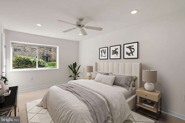 bedroom featuring ceiling fan and light hardwood / wood-style floors