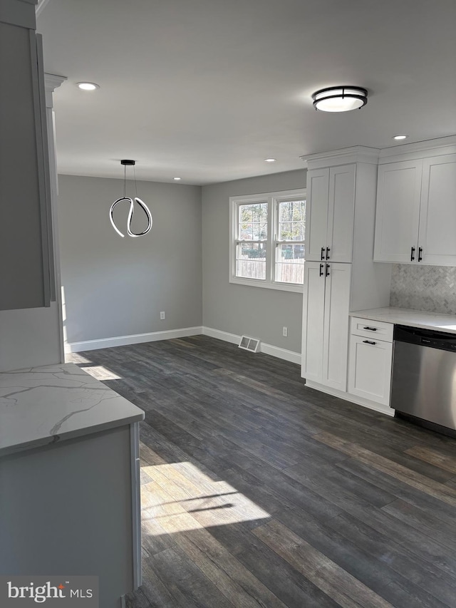 kitchen with pendant lighting, dishwasher, tasteful backsplash, white cabinets, and dark hardwood / wood-style flooring