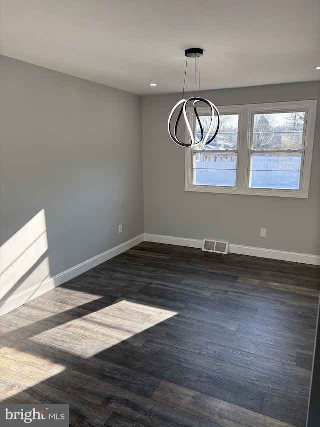 unfurnished dining area featuring dark hardwood / wood-style floors