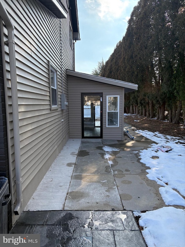 view of snow covered patio