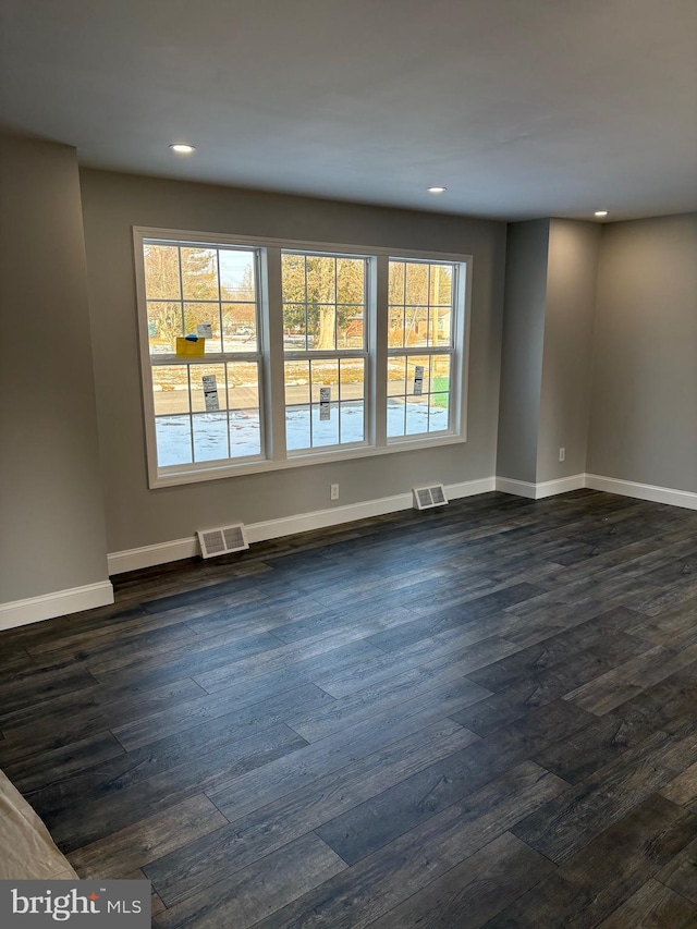 empty room featuring dark hardwood / wood-style floors