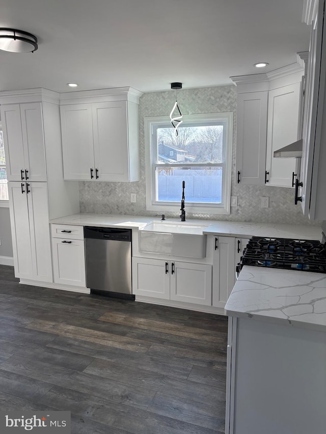 kitchen with white cabinetry, dishwasher, and sink