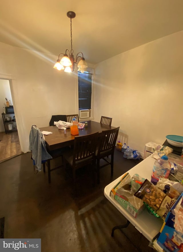 dining area with an inviting chandelier and cooling unit