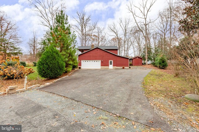 view of property exterior with a garage