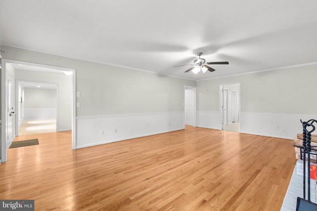 unfurnished room with ceiling fan, light hardwood / wood-style flooring, and ornamental molding