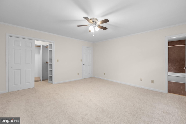 unfurnished bedroom with light carpet, crown molding, and ceiling fan