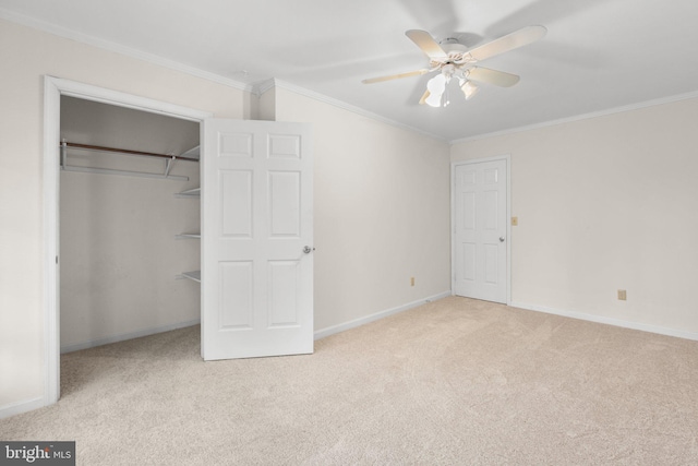 unfurnished bedroom featuring ceiling fan, light colored carpet, and ornamental molding