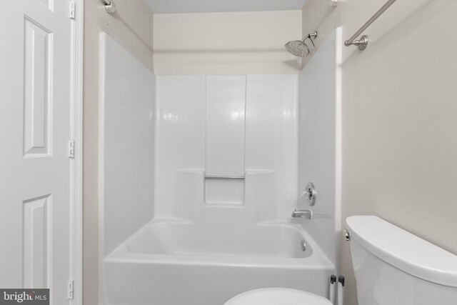 bathroom featuring toilet and shower / washtub combination