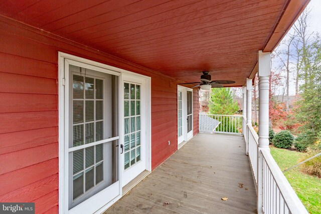 wooden deck featuring ceiling fan and a porch