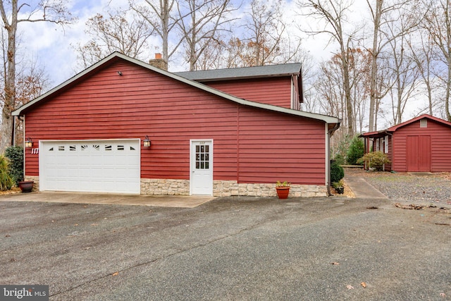 view of home's exterior with a storage shed