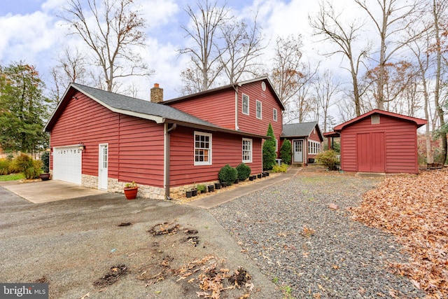 view of home's exterior featuring a shed