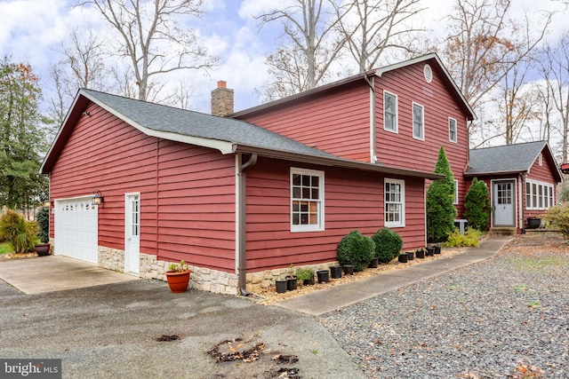 view of side of property with a garage