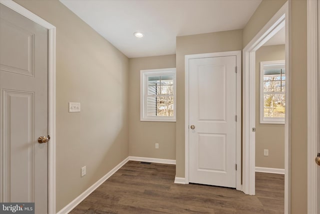 hallway featuring dark wood-type flooring